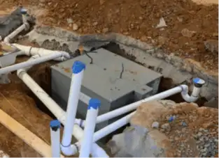 Grease Trap set in-ground grease trap and pvc piping plumbed into ground before the concrete floor is layed